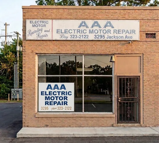Original brick storefront at 3295 Jackson Avenue in Memphis with its hand-painted electric motor repair sign.